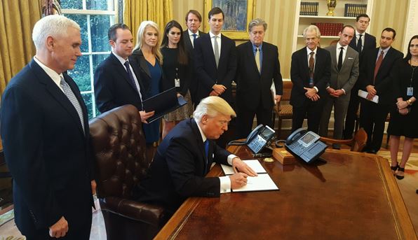 Trump signing a new legislation