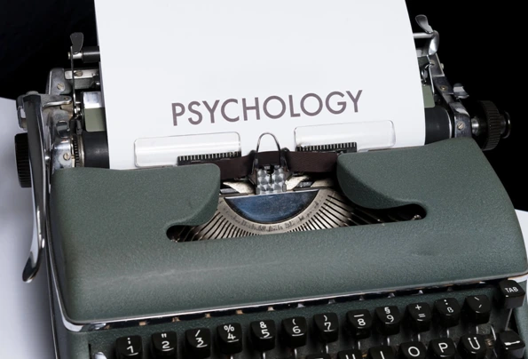 Typewriter with paper that reads 'psychology'